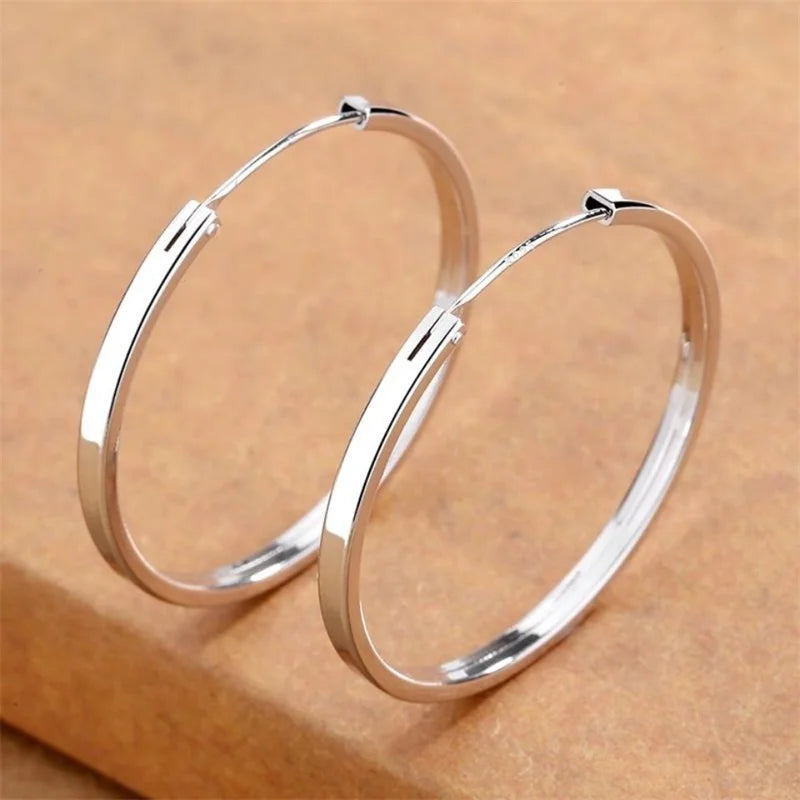 Statement hoop earrings, silver tone